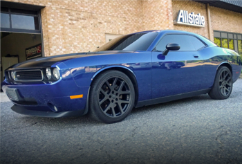 Custom alloy wheel and rim paint in black for blue muscle car